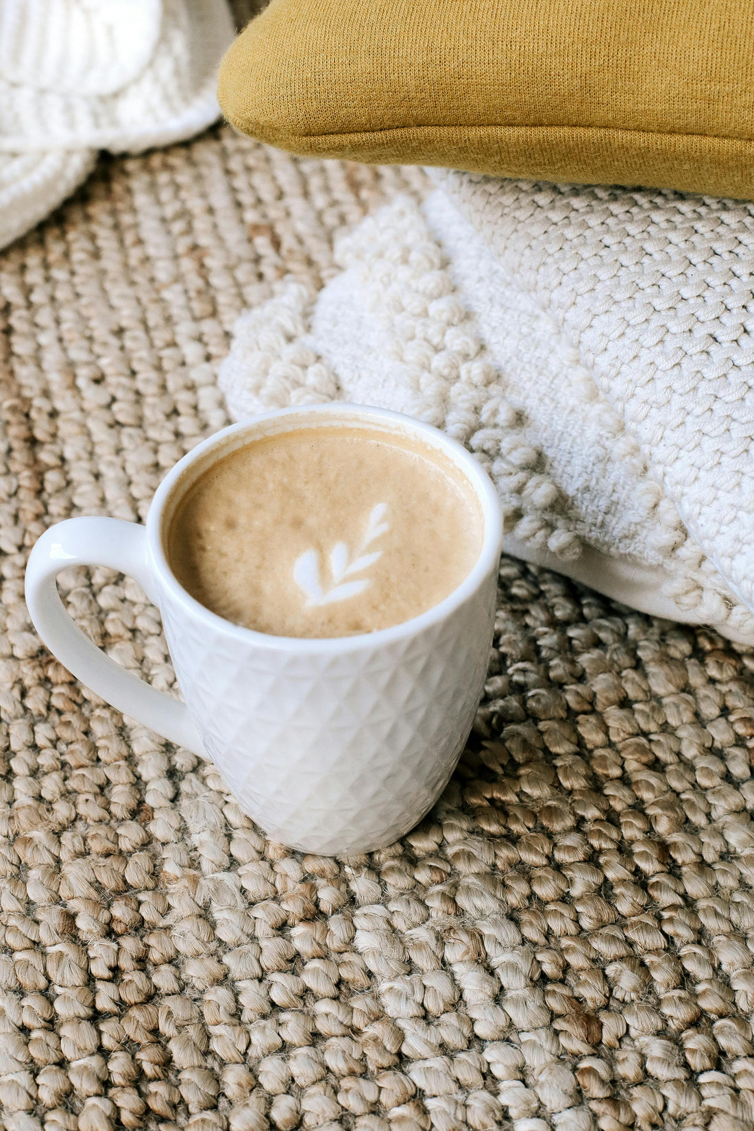 A cup of coffee and a blanket for blog about small things in life bringing joy